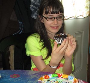 Jordan unwrapping her birthday cupcake