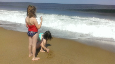 Jordan making her sand mound/castle as the waves come in...